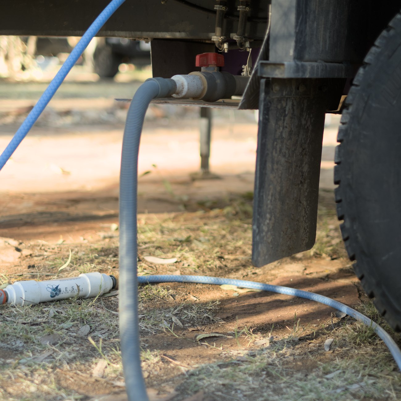Grey water tank outlet and hose