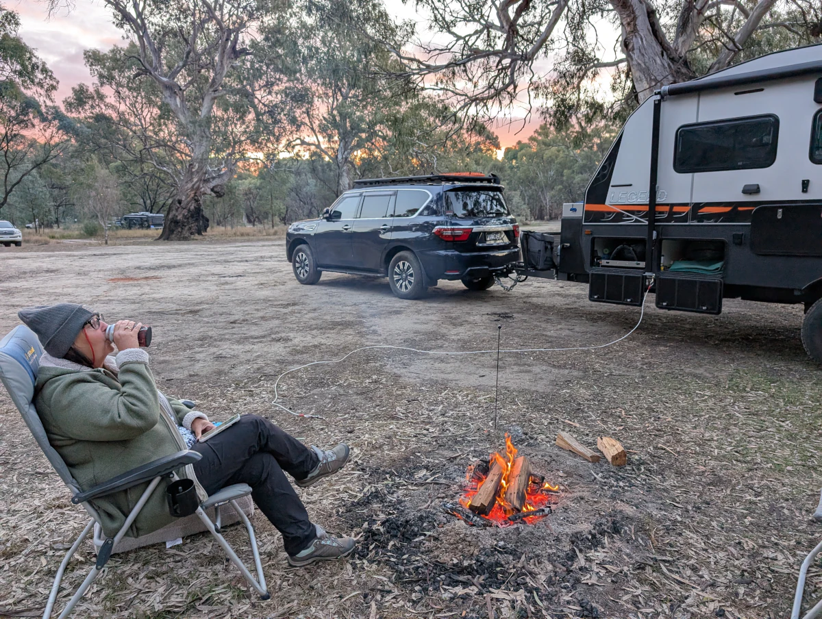 Cathy at camp having a drink